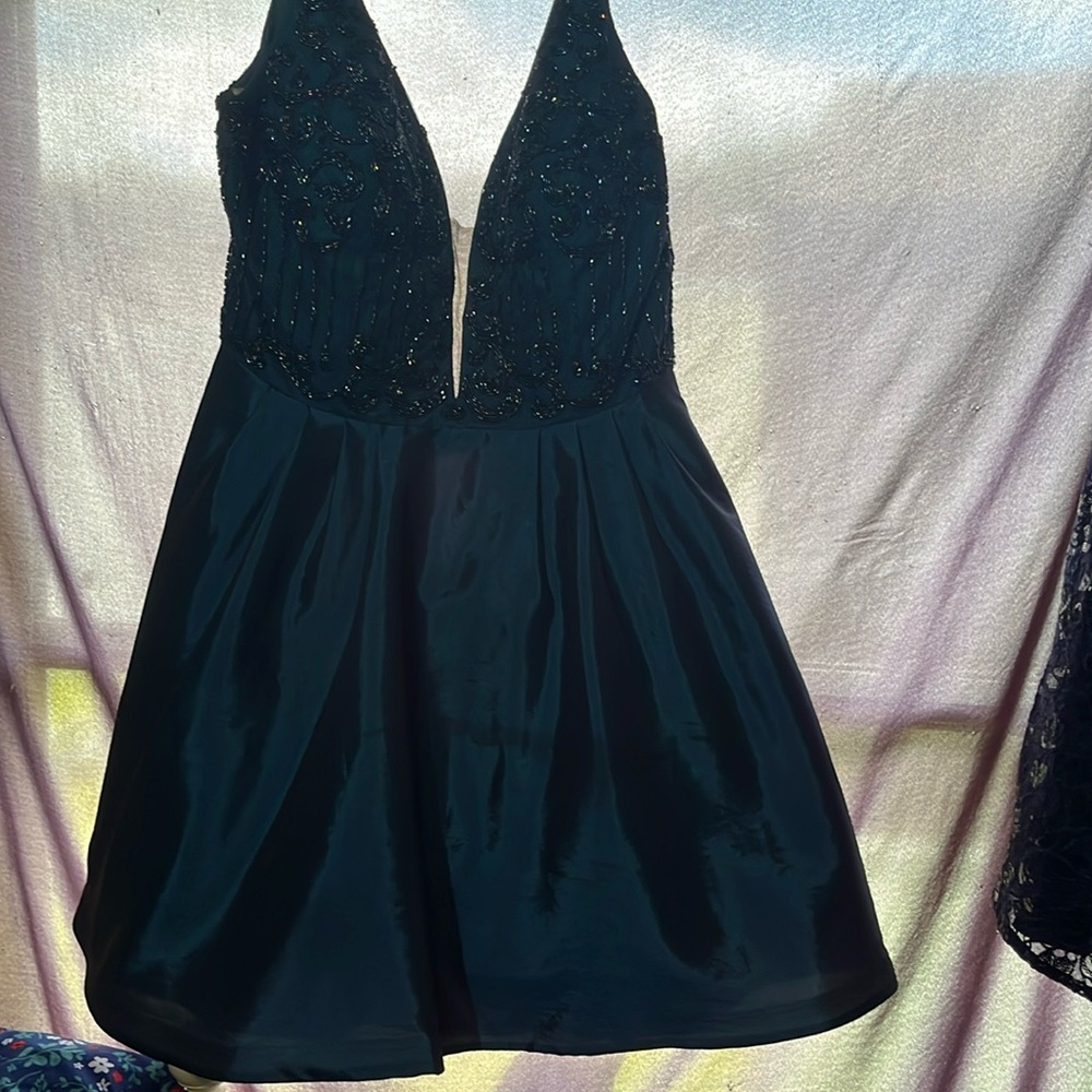 Sherri Hill size 14 homecoming dress. Small stain may come out in dry cleaning.